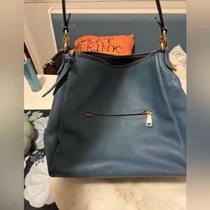 Blue Coach shoulder bag.